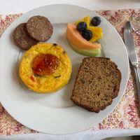 Completely vegan quiche with vegan sausage, apple bread, and fruit.  at Heartstone Inn Bed & Breakfast and Cottages in Eureka Springs