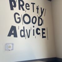 logo on wall  at Pretty Good Advice in San Jose