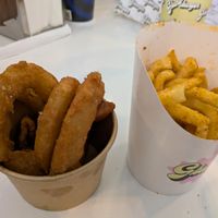 Curly fries and onion rings, decent portion of fries, but onion rings were small for $7.50 at GBurger Wellington West in Ottawa