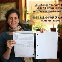 Owner Julie tilt reuses printing paper for her notepad  at Hummingbird Wholesale in Eugene