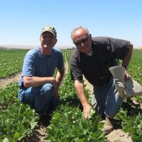 James taking a moment to pose as he talks with one of our farmers at Hummingbird Wholesale in Eugene