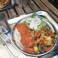 Salad with tzatiki, rice, tomato sauce with spices, tofu and roasted veggies at Govinda in Eger