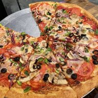 Vegan veggie pizza made with Miyoko’s *new* Vegan Pizza Mozzarella 🌱 bring your own vegan cheese and they’ll cook it!   at Angelo's Pizza in Buxton