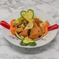 Fresh fattoush salad with mixed vegetables, herbs and crispy bread pieces, dressed with tangy pomegranate molasses at Damastique in York