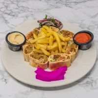 Authentic Syrian falafel wraps served with hummus, crispy fries and fresh salad. Enjoy vegan-friendly Middle Eastern flavours in the heart of York. at Damastique in York