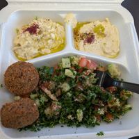 Sampler plate with baba ganoush, hummus, falafel, and tabouleh at Tum Tums Mediterranean in Florence