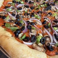 Their Vegan Pizza is the best pizza ever!!!  at Mezza Luna Pizzeria in Eugene