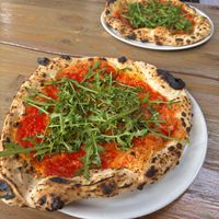 Pizza parmigiana with arugula, eggplant, olive oil and vegan cheese.  at Sotto Pizzeria Porvoo  in Porvoo