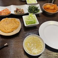 Side dishes, pancake, porridge and cooked radish  at Maji - 마지 in Seoul