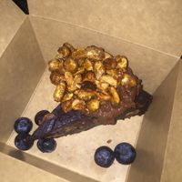 Brownie with chocolate cream and caramelized peanuts  at The Vegan Eagle in Hamburg