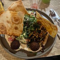 Hummus with lentil balls, lavash and salad at The Vegan Eagle in Hamburg