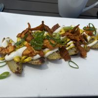 Loaded cheesy potatoes  at Trilogy Sanctuary in La Jolla
