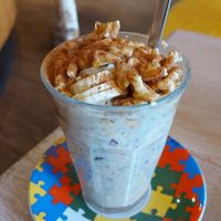 Warm oatmeal with oat milk, fruits and nuts at Bagels & Beans - Piet Heinplein in The Hague