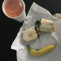 Hummus Veggie Wrap with Sunrise Sunset Smoothie and Banana for side at Tropical Smoothie Cafe in Mount Pleasant