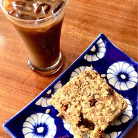 Khmer iced coffee and vegan flapjack.  at Epic Arts Cafe in Kampot