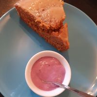 The wonderful carrot caramel cake!!! With some red fruits yoghurt!!! ❤️🥰😍 at Nirvana Cafe in Luxembourg City