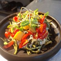 Raw Zucchini pasta salad , mango, cherry tomato avocado pesto sproots cashew cream sauce  at Soul Garden in Koh Phangan