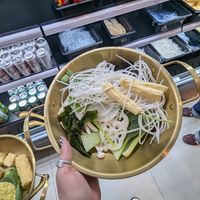 you choose your broth ingredients, then choose which broth you would like and you pay by weight. at Round Belly Hotpot  in Markham