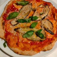 Pizza parmigiana at La Colubrina in Milan