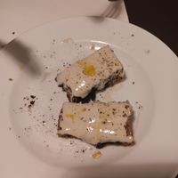 Half-eaten truffle bruschetta at La Colubrina in Milan