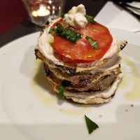 Raw parmigiana with cheese (made from cashews and herbs), tomatoes, basil, and dried eggplants. at La Colubrina in Milan