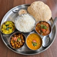 Lunch Time Special: Vegetarian Thali. £9.30. Served daily between 11:30 and 14:30.👌 at Thira Restaurant in Blackburn