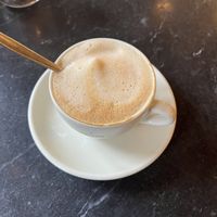 Cappuccino with organic oatmilk  at Schwarzes Cafe  in Berlin