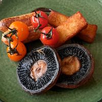 Cooked breakfast: slow‑cooked mushrooms, homemade hash browns, vegan sausages, roasted tomatoes, and pickled walnut & black garlic ketchup at The Green Bear Guesthouse  in Rhayader