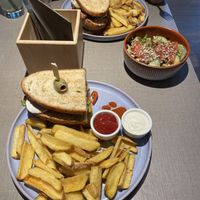 Sandwiches with fries and a side salad  at Katzentempel München Freiham in Munich