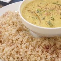 Vegetable curry with coconut cream: chickpeas, green beans, broccoli and sweet potatoes. With whole rice.  at Nagila in Jerusalem