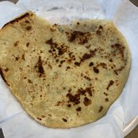 This Aloo Paratha was sooo good, the cashier recommended it. Potato stuffed bread.  at Taj Chaat House in Irving