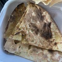 The Tandoori Roti was alright, I definitely recommend getting a paratha instead though because the bread is so much more flavorful and filling for the same price. The Aloo was 👍 at Taj Chaat House in Irving