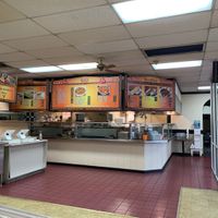 Part of the cooking stations and register. at Taj Chaat House in Irving