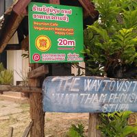Follow the sign to find the restaurant at Reunion Cafe Luang Prabang in Luang Prabang
