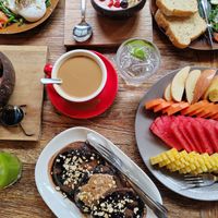 Vegan chocolate and peanut pancake + fruit platter at Kayu Cafe in 