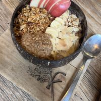 Choco Peanut Bowl - banana, coconut cream, raw cacao, peanut butter, topped with banana, apple, almond, peanut, cacao nips & granola  at Kayu Cafe in 