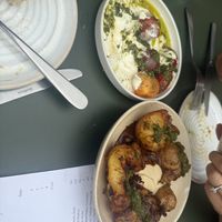 Crispy potatoes, and tomato salad  at Root Bath in Bath