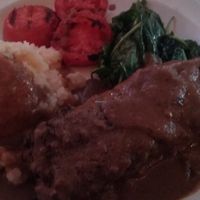 Vegan hippie meatloaf. Comes with greens, roasted tomatoes and mashed potatoes. at Baba Yega in Houston