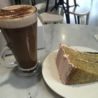 Pistachio cake and hot chocolate. This hot chocolate is the best I've ever had! at Ruby's of London in South East London