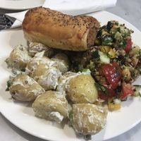 Potato salad,quinoa salad and vegan sausage roll.  at Ruby's of London in South East London
