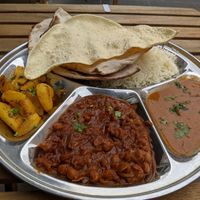 Vegan thali with Dal Fry, Chana Masala and Jeera Aloo at Sitar in Rome