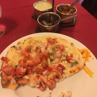 Masala Papadum—a crispy lentil bread with fresh tomatoes, onions, and herbs at Sitar in Rome