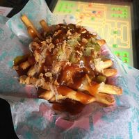 Fritz’ fries with sauerkraut, gherkins, roasted onion and sauce  at Beelzebab in Brighton