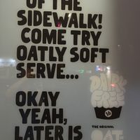 Sign outside for vegan Oat-ly yogurt at 16 Handles - Upper East Side in New York City