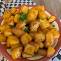 Spicy potatoes, very delicious but the bowl was constantly tipping over. at Solomon's Oven in Ottawa