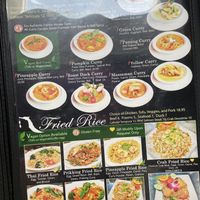 Menu showing symbol that means a vegan option is available  at Thai Wisdom Bistro Edmonds in Edmonds