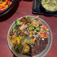 Burrito bowl, side order of guac, remnants of tropico salad at Bandoleros Mexican Grill in Concord