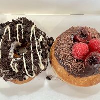 Cookies and cream + black cherry doughnuts (June 2026 vegan options)   at Perk Pantry in Inverness