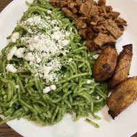 Tallarin Verde (Green pesto noodles w/ side of sweet plantains and vegan meat)  at Tallarin Verde Peruvian Restaurant in Blairsville