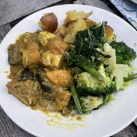 Tofu and coconut curry with green veg and roast potatoes   at Vaults and Garden in Oxford
